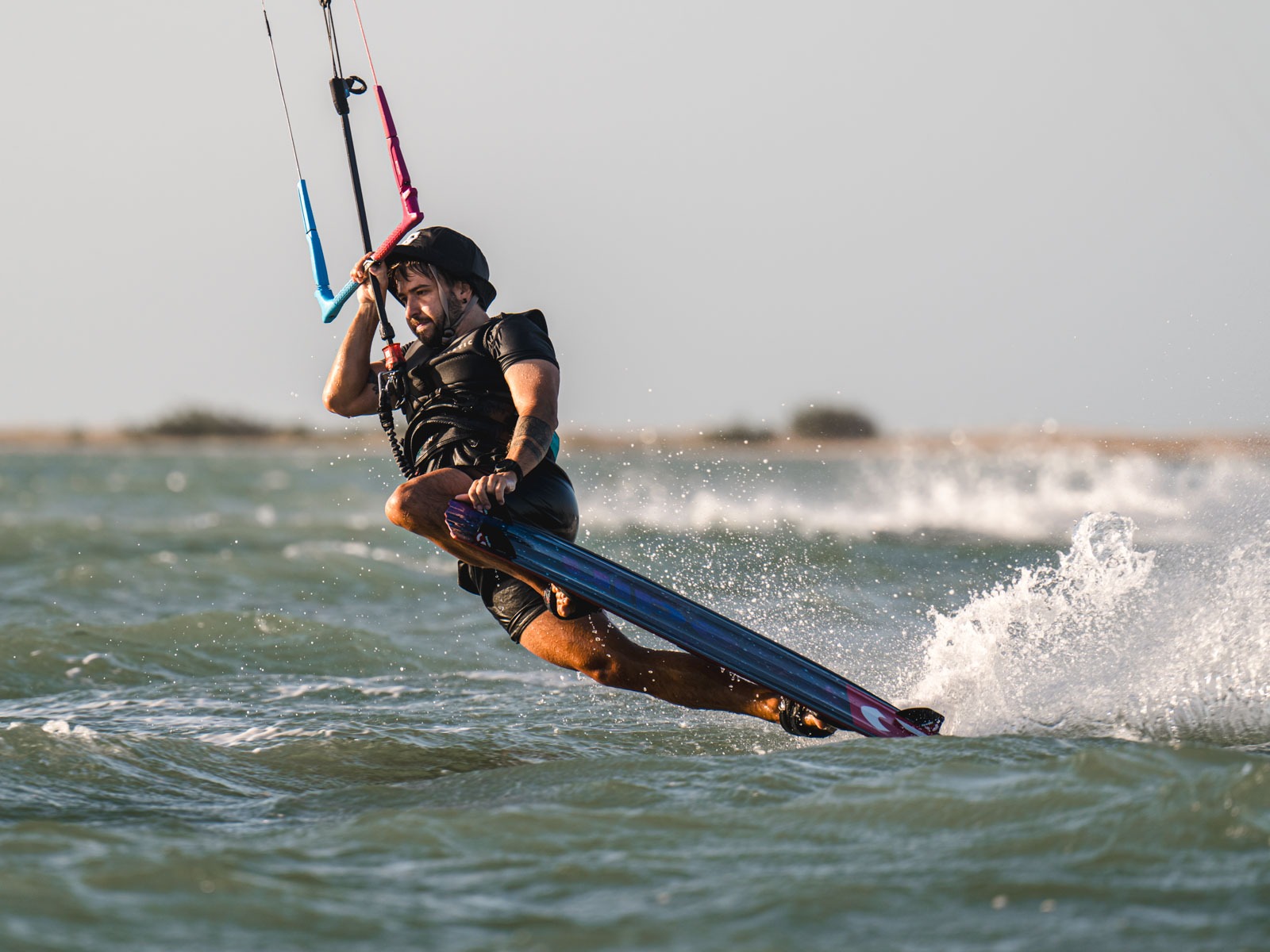 Aleksei pulls a darkslide during SA Masterclass kiteboarding camp